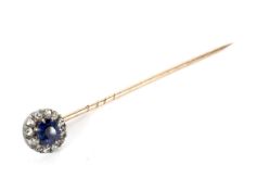 An early 20th century sapphire and diamond cluster stick pin.