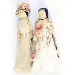 Two 19th century German pegged painted wooden dolls.