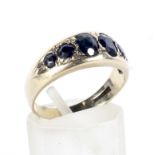 A modern 9ct gold and sapphire six stone ring.