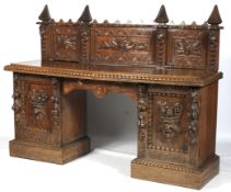An early 20th century, heavily carved Continental pedestal sideboard.