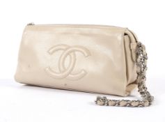 A Chanel 'Timeless' nude leather wallet on a chain.