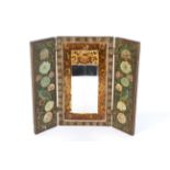 An early 20th century Indian painted wooden folding wall mirror in triptych form.