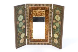An early 20th century Indian painted wooden folding wall mirror in triptych form.