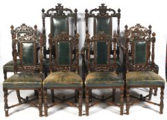 A set of six early 20th century Jacobean style carved oak dining chairs.