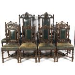 A set of six early 20th century Jacobean style carved oak dining chairs.