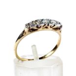 An early 20th century gold and diamond five stone carved half-hoop ring.