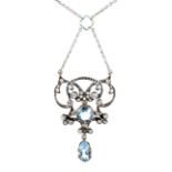A late Victorian aquamarine and diamond double-scroll pendant necklace.