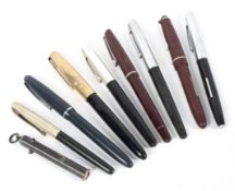A collection of mid-century vintage fountain pens.