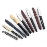 A collection of mid-century vintage fountain pens.