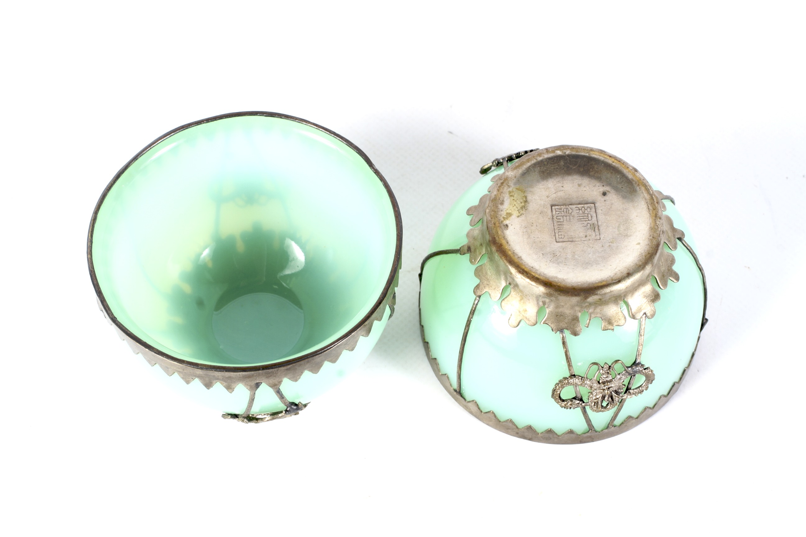 A small pair of early 20th century Chinese white metal mounted pale-green glass bowls. - Image 2 of 2