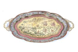 A 20th century Indian enamelled brass two-handled shaped oval tray.
