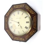 A Regency brass inlaid octagonal mahogany 36-hour wall clock.