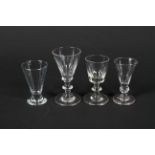Three 19th century port glasses and a 20th century glass similar.