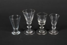 Three 19th century port glasses and a 20th century glass similar.