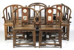 A set of eight Chinese hardwood stone inlaid horseshoe shaped chairs.