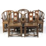 A set of eight Chinese hardwood stone inlaid horseshoe shaped chairs.