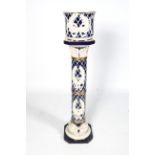 A 20th century Italian pottery jardiniere on stand.