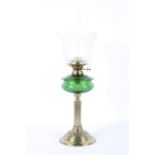 A Victorian brass oil lamp with etched shade.