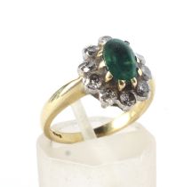 A modern 18ct gold, emerald and diamond oval cluster ring.