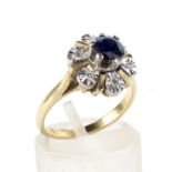 A mid-20th century gold, sapphire and diamond cluster ring.