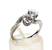 An early 20th century platinum and diamond cross-over ring.