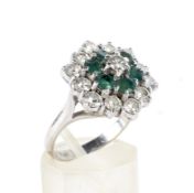 A vintage 18ct white gold, emerald and diamond hexagonal cluster ring.