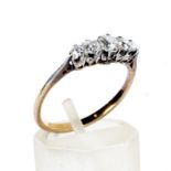 A vintage gold and diamond five stone ring.
