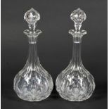 A pair of Victorian cut-glass shaft and globe decanters and stoppers.