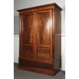 An Edwardian mahogany gentleman's wardrobe.