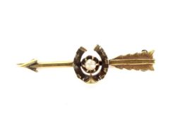 A late Victorian gold and half-pearl brooch.