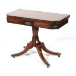 A Regency rosewood and mahogany fold over revolving card table.