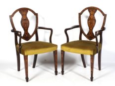 A pair of Edwardian marquetry inlaid Georgian style dining chairs.