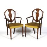 A pair of Edwardian marquetry inlaid Georgian style dining chairs.