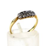 An early 20th century gold and diamond two-row ring.