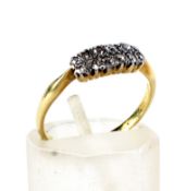 An early 20th century gold and diamond two-row ring.