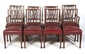 A set of eight Edwardian inlaid mahogany dining chairs with pierced splats.