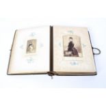 A Victorian leather bound photo album titled Porcelain, Pottery and Portraits.