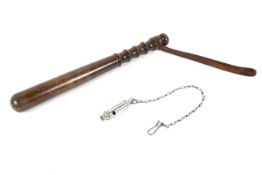 A turned wooden police truncheon and a ARP (J Hudson & Co) whistle.