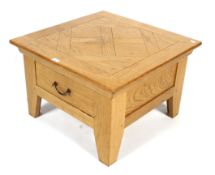 A contemporary oak single drawer coffee table.