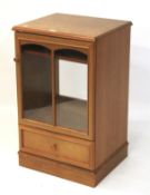 A contemporary glazed Hi fi cabinet with single drawer base, L52.5cm x D45cm x H85cm.