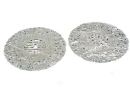 Two carved Chinese mottled green and whi
