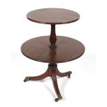 An Edwardian mahogany two tier pedestal