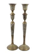 A pair of brass Islamic candle stands. T