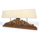 A large carved wooden table lamp. With p