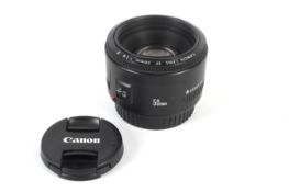 A Canon EF 50mm 1:1.8 II lens. With front and rear caps.