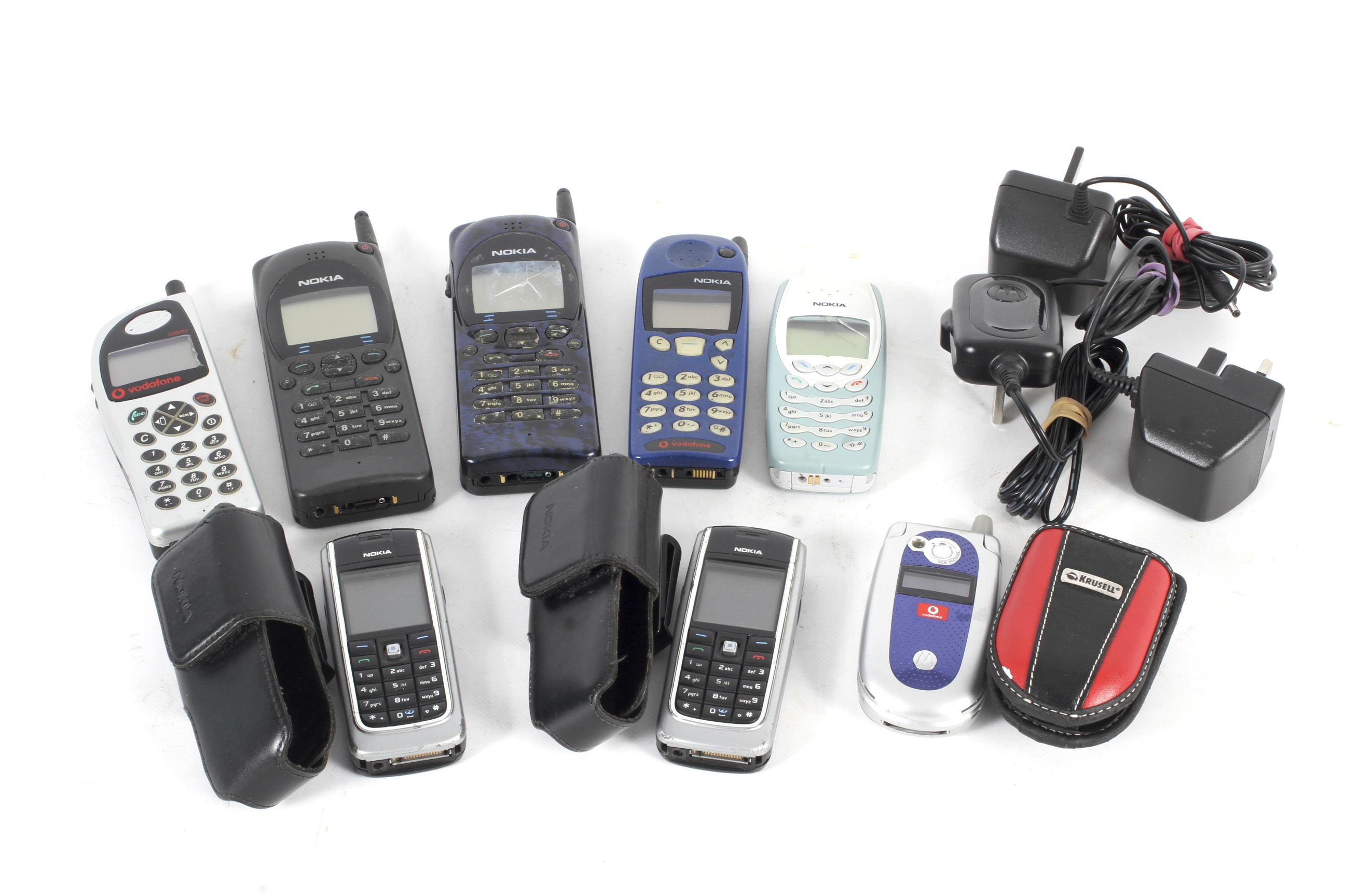 A collection of eight assorted vintage mobile phones.