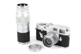 A Leica M2 35mm rangefinder camera, chrome, serial number 1006605. Together with a Leitz 50mm 1:2.