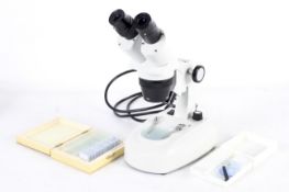 An Apex Explorer Plus microscope and slides.