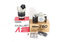 A Nikon F60 35mm SLR camera and a Tamron AF 28-200mm 1:3.8-5.6 lens.