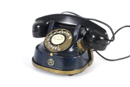 A RTT 56B retro rotary dial telephone.